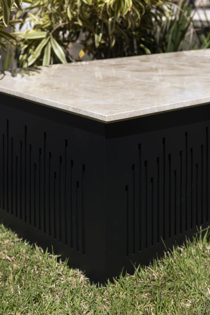 Magna Polly Tank Sub with a stone top, shown from an angle in a garden