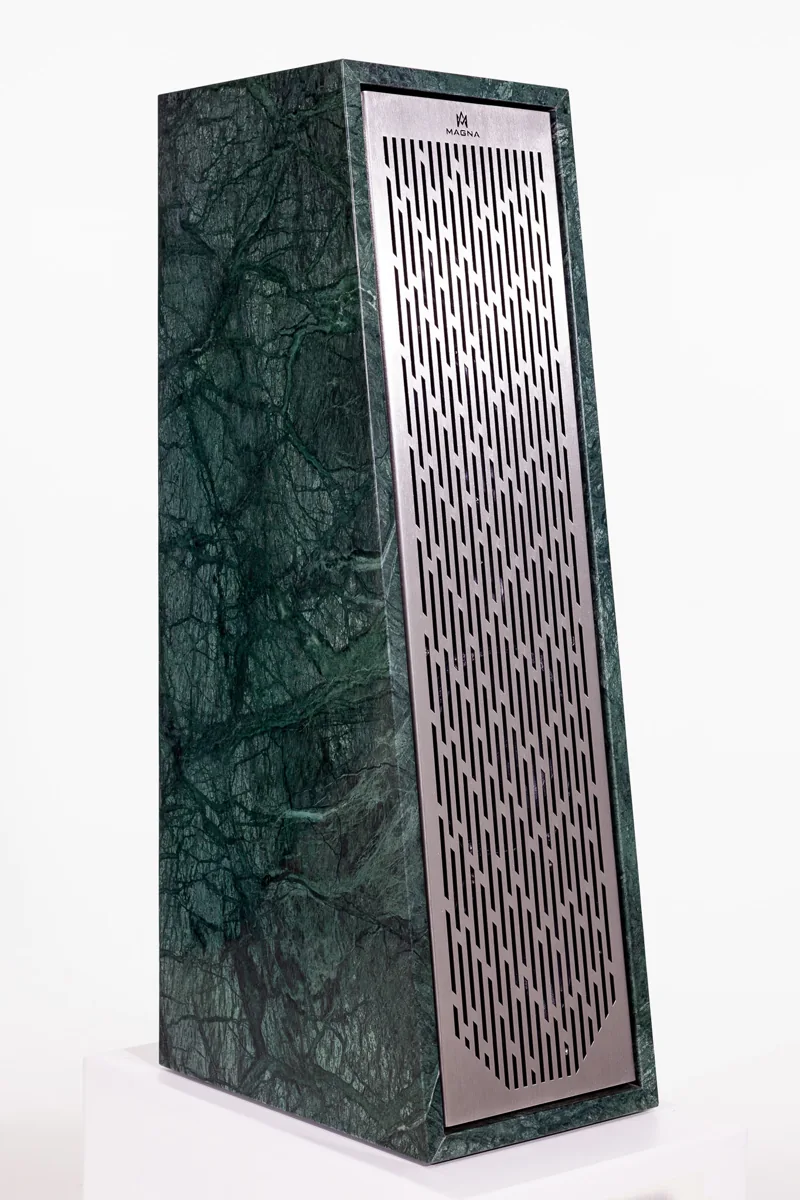 Magna Rock F66 speaker showing a green stone cabinet and grille